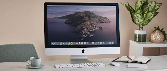 Apple iMac desk setup with magic keyboard and mouse