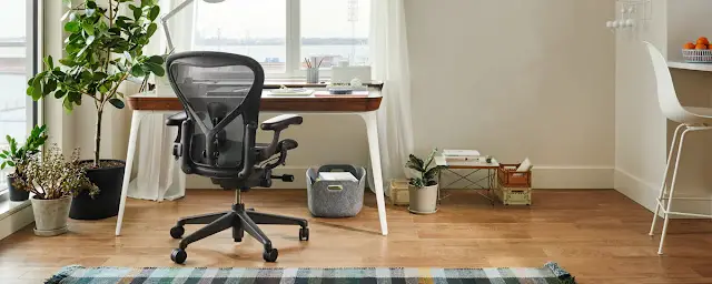 Herman Miller ergonomic chair with desk setup and monitor