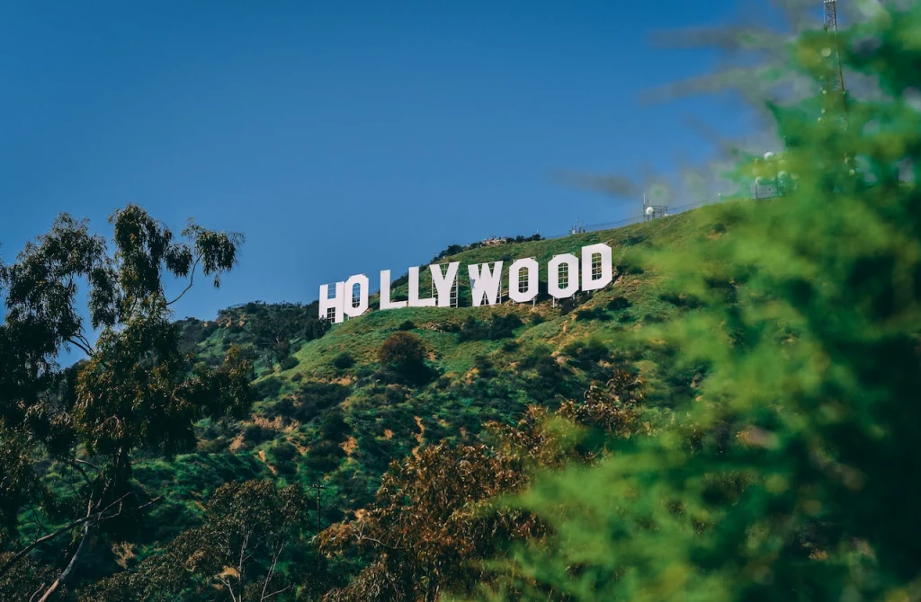 Hollywood sign sitting on top of lush green hills