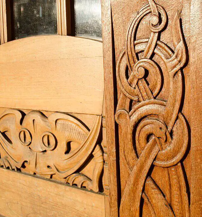 Celtic inspired ornaments and fable animals on the entrance door to the Norwegian Art Nouveau center