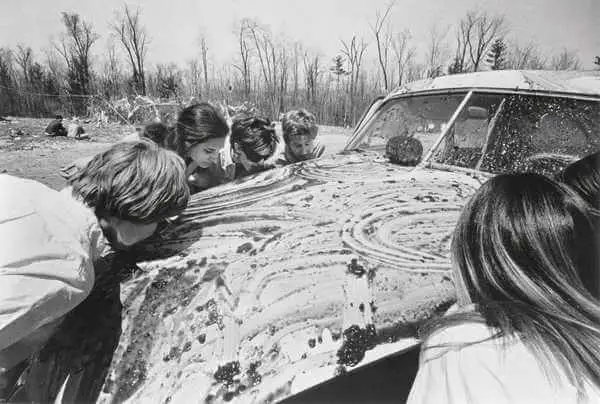 Sol Goldberg's photograph of participants in Allan Kaprow's 'Women licking jam off a car,' from his series of "happenings" household (1964)
