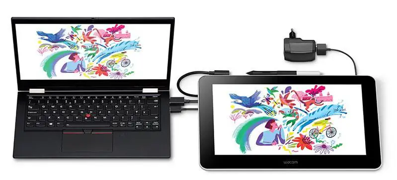 Wacom One drawing tablet connected using USB cable with laptop computer